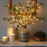 Olive branch with decorative lights — view 1